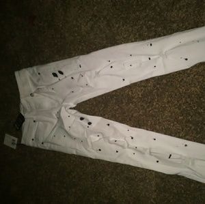 White jeans black paint splatter